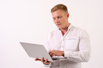 Caucasian businessman man with a laptop working on a white background