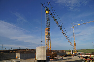 Folding crane mounting on a bridge construction site for the overpass of a service road over the future A143 motorway