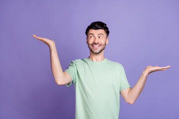 Photo of cheerful charismatic stylish man raise two arm interested look empty space solution...