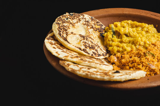 Sri Lankan style coconut roti bread with coconut sambol and dhal curry.