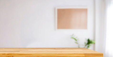 Wood table in modern home room interior with empty copy space on the table for product display mockup.