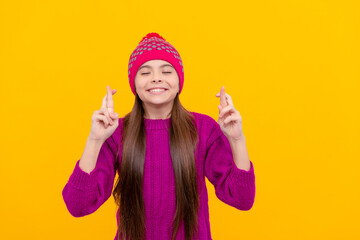 happy kid wear warm clothes on yellow background. children winter fashion and beauty.