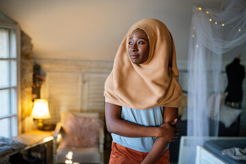 Tranquil portrait of beautiful young black muslim woman wearing hijab