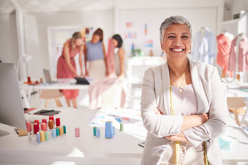 Elderly woman, smile and fashion designer with arms crossed for leadership, small business or...