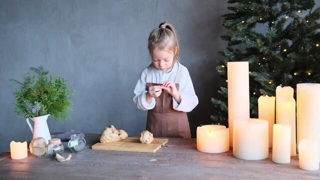 little girl dancing while making a christmas cupcake