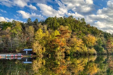 View of beautiful autumn trees reflected in the water in the Beavers Bend State Park, Oklahoma
