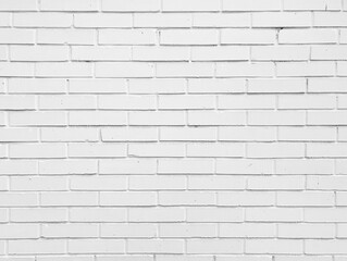 Old bright white brick tiles wall textured background. Kitchen wallpaper concept.