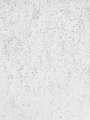 White stucco wall texture background. Plastered and painted wall with rough surface.