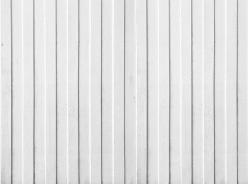 White concrete wall texture with vertical scratched plaster lines