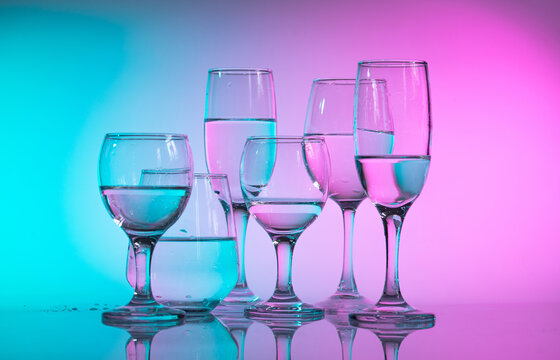 Wine glasses with neon multicolor light