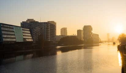 Fototapeta premium early morning sunrise cityscape view at the river spree in Berlin, Germany