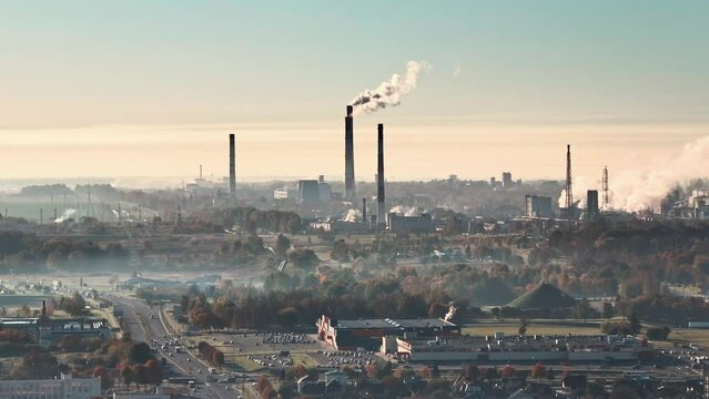 aerial view on smoked pipes of chemical enterprise plant. Air pollution concept. Industrial landscape environmental pollution waste of thermal power plant