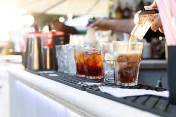 cocktail on bar counter sun set