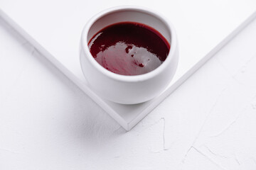 jar of red berry jam isolated