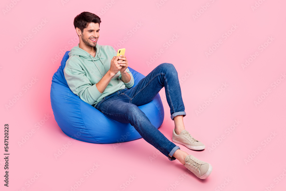Aufkleber full length photo of positive man sit chair use modern device chatting followers write post empty sp