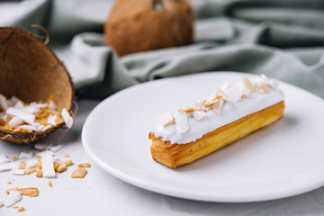 french eclair with coconut on plate