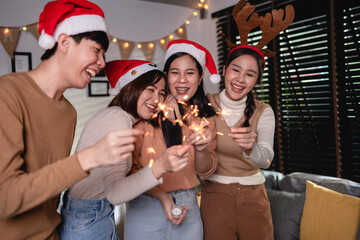 group Asian young adult people celebrate Christmas with sparkler