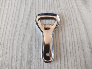 Metal bottle opener on the table
