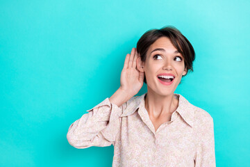 Photo of positive concentrated lady arm ear listening news interested look empty space meaning...