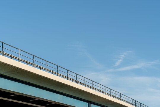 Low angle shot of the A45 stone bridge under a blue sky in Wetzlar, Germany