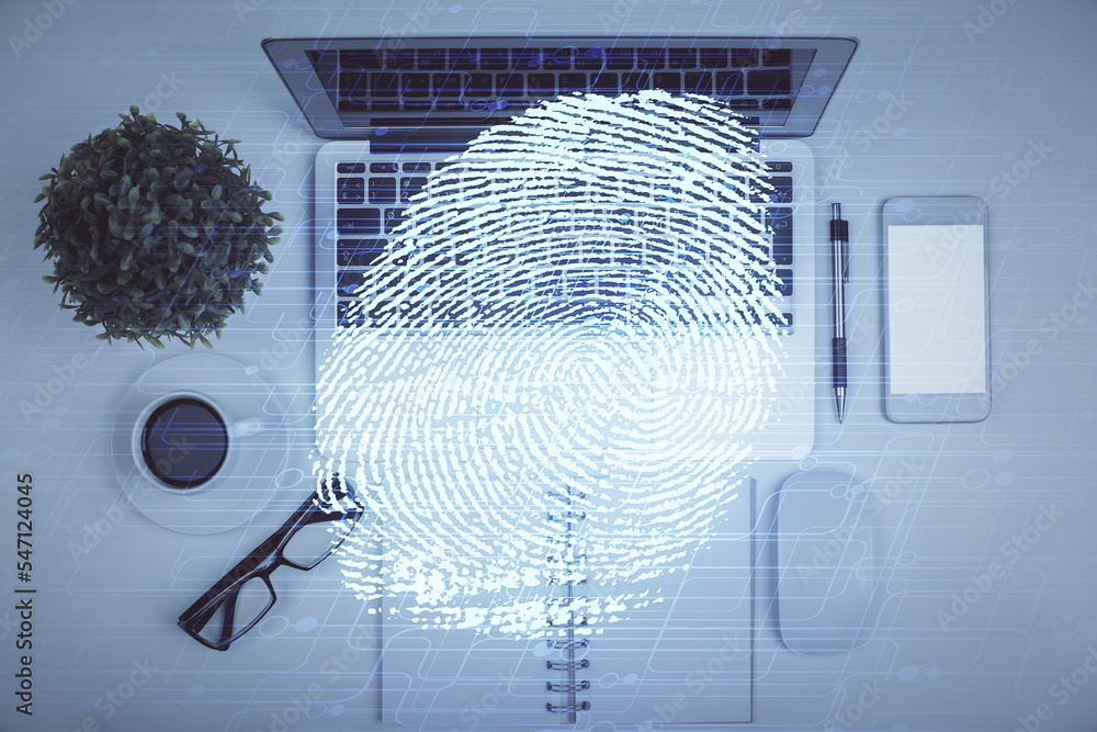 Poster Finger print over computer on the desktop background. Top view. Double exposure. Concept of securitization.