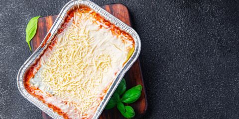 lasagna vegetable container snack vegetarian meal food on the table copy space food background...