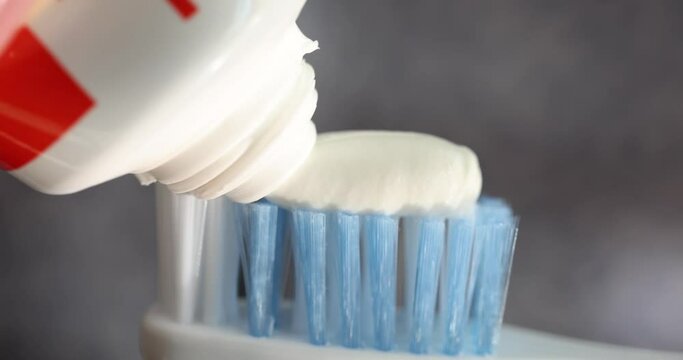 Closeup of white toothpaste with toothbrush