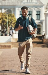 University, education and phone with a black man student typing a text message while carrying books. Contact, study and scholarship with a male pupil walking to class at college for development