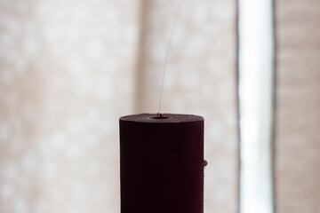 Smoke comes from an extinguished candle. Blackout due to war in Ukraine