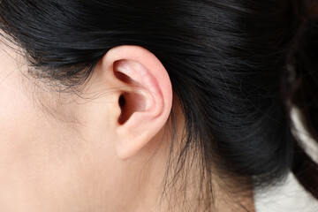 Magnified side view of woman's ear