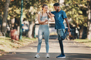 Obraz premium Interracial, couple and stretching for training, wellness and exercise to relax and workout in park. Health, man and woman outdoor for practice, fitness and together for bonding, healthy and talking.