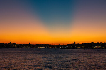 Naklejka premium Istanbul Skyline. Anticrepuscular sunrays over the Istanbul at sunset