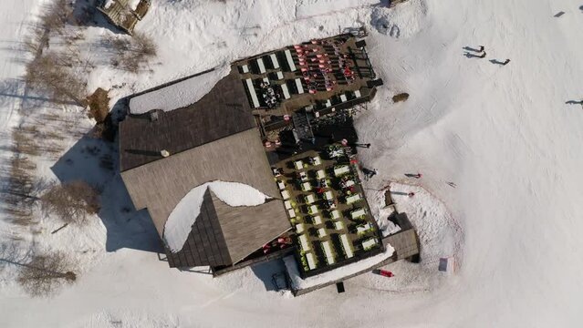 Apres Ski in the mountain resort in winter drone shot