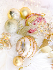Christmas composition. Christmas balls, pink and gold decorations background. Flat lay, top view, copy space.