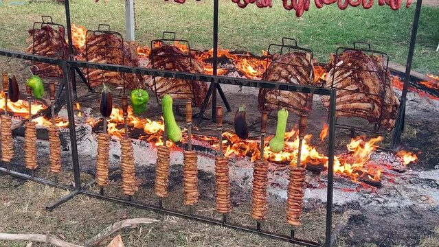 Brazilian Barbecue, rib, meats on ground fire.