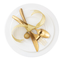 Christmas table setting top view. Golden cutlery and decoration on white dishes, transparent...