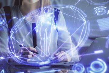 Double exposure of woman hands typing on computer and general theme hologram drawing. Education concept.