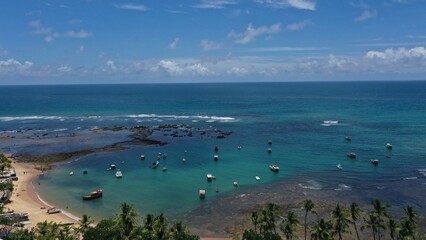 Wonderful view of Praia do Forte beach near Salvador with fishing boats, turquoise waters and a...