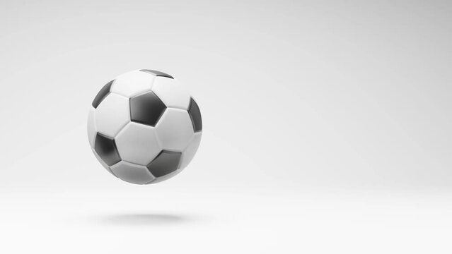 Soccer Ball Spinning on a Studio Light Gray Background, Seamless Loop 3D Animation with Copy Space