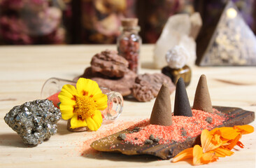 Incense Cones on Stone Slab With Crystals and Flowers