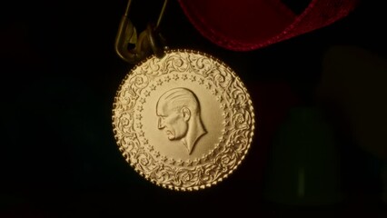 A spinning Republic of Turkey gold coin. Atatürk silhouette. Mustafa Kemal Atatürk in relief. 4K