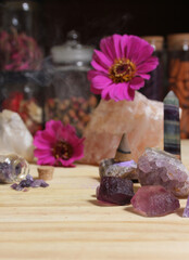Amethyst Crystals With Flowers and Incense Cone on Meditation Table