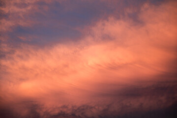 Obraz premium Dramatic clouds formations during a colorful sunset after a summer storm
