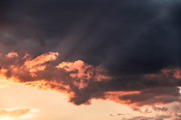 Fototapeta premium Dramatic clouds formations during a colorful sunset after a summer storm