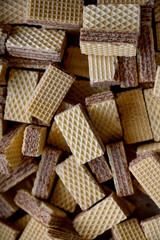 Group square wafer chocolate cream biscuits crispy small, wafer cookies filled with cream is a type of baked goods that have a waffle pattern, isolated on wSweet cookies. Small waffle cookieshite back