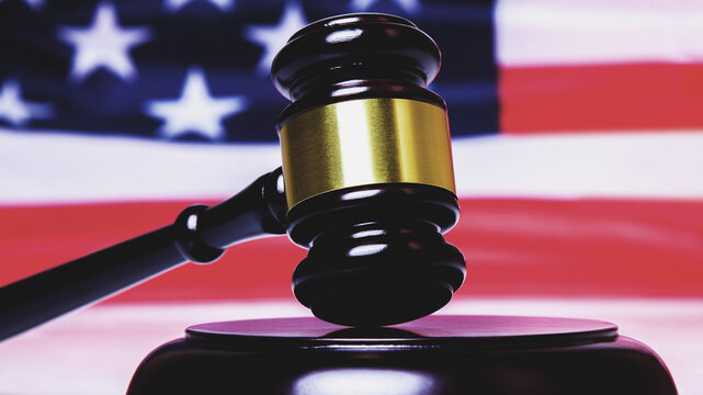 Judge Gavel Against United States National Flag As Symbol Of Judicial System Of The USA. Close Up. Horizontal Image.