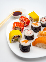 sushi on a plate with chopsticks