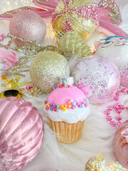 Christmas composition. Christmas balls, pink and gold decorations background. Flat lay, top view, copy space.