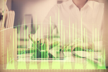 Double exposure of forex chart sketch hologram and woman holding and using a mobile device. Financial market concept.