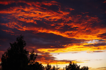 Fototapeta premium Dramatic red clouds during sunset.
